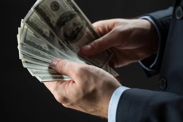 Close up of businessman hands holding money — Stock Photo, Image