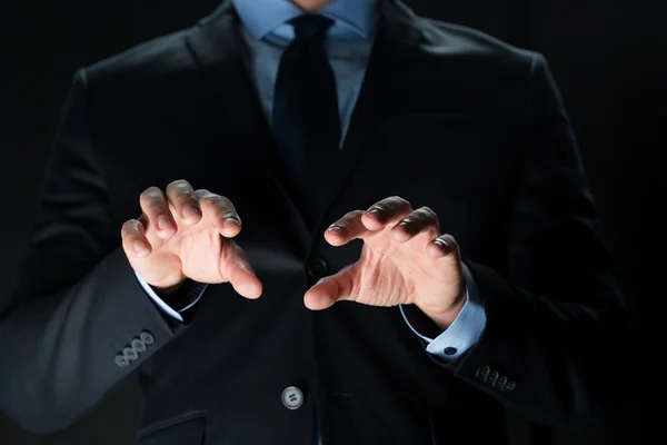 Close up of businessman touching virtual screen — Stock Photo, Image