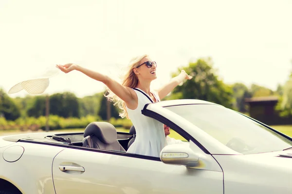 Happy man and woman driving in cabriolet car — Stock Photo, Image