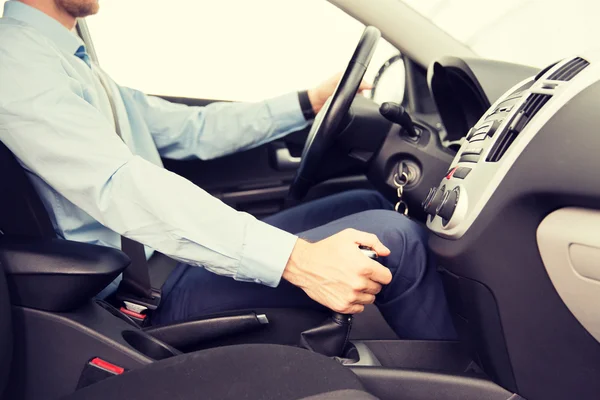 Close up of young man driving car — Stock Photo, Image