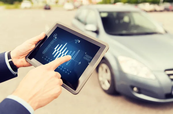 Close up of man with tablet pc diagnoses car — Stock Photo, Image