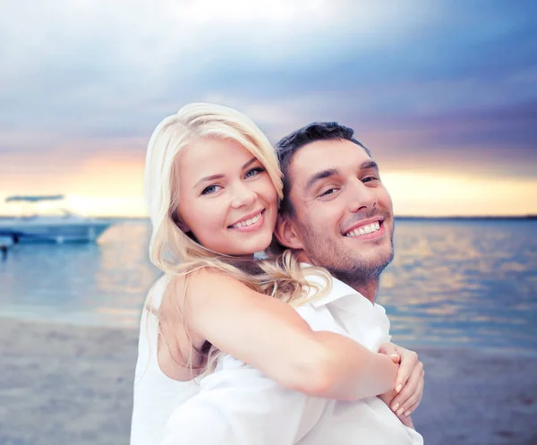 Couple having fun and hugging on beach — Stock Photo, Image