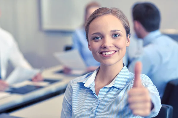 Group of smiling businesspeople meeting in office — Stock Photo, Image