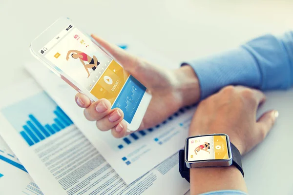 Close up of hands with smart phone and watch — Stock Photo, Image