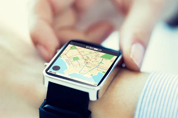 Close up of hands with map on smartwatch screen — Stock Photo, Image