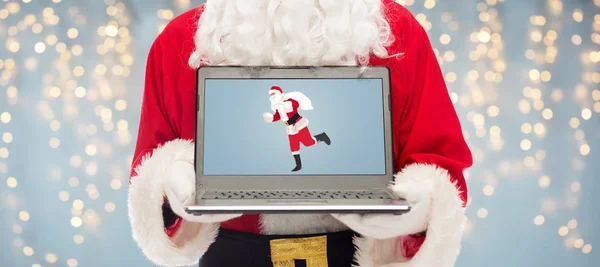 Close up of santa claus with laptop — Stock Photo, Image