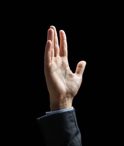 Close up of raised businessman hand over black — Stock Photo, Image
