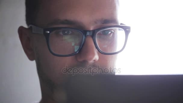 Happy young man in eyeglasses with tablet pc — Stock Video