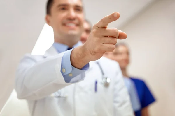 Close up of doctor pointing finger at hospital — Stock Photo, Image