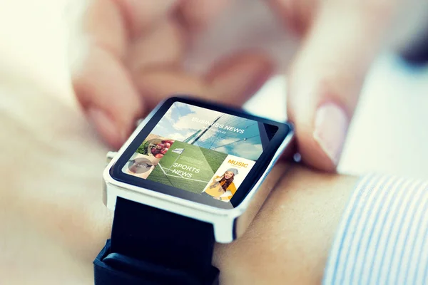 Close up of hands with application on smartwatch — Stock Photo, Image