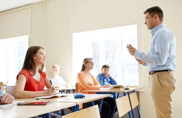 Students and teacher with tablet pc at school — Stock Photo, Image