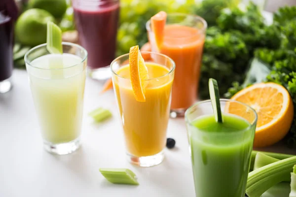 Glasses with different fruit or vegetable juices — Stock Photo, Image