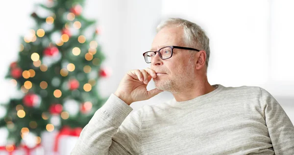 Senior man in glasses thinking — Stock Photo, Image