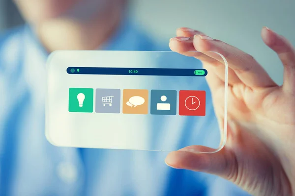 Close up of woman with transparent smartphone — Stock Photo, Image