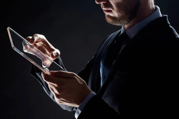 Close up of businessman with transparent tablet pc — Stock Photo, Image