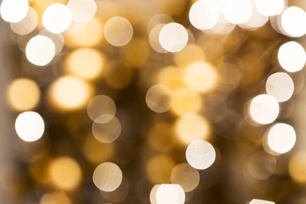 Rozmazané zlaté vánoční světla bokeh — Stock fotografie
