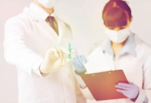 Doctors with syringe — Stock Photo, Image