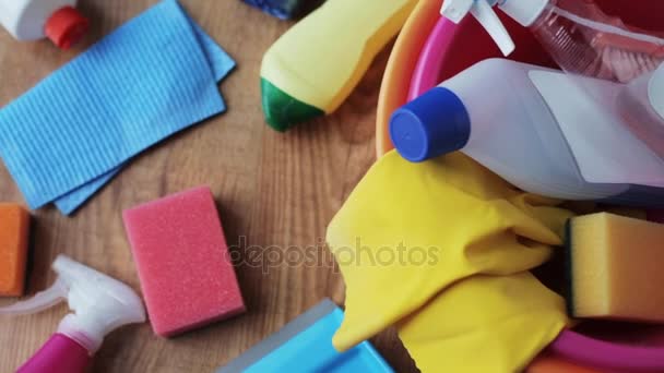 Basin with cleaning stuff on wooden floor — Stock Video