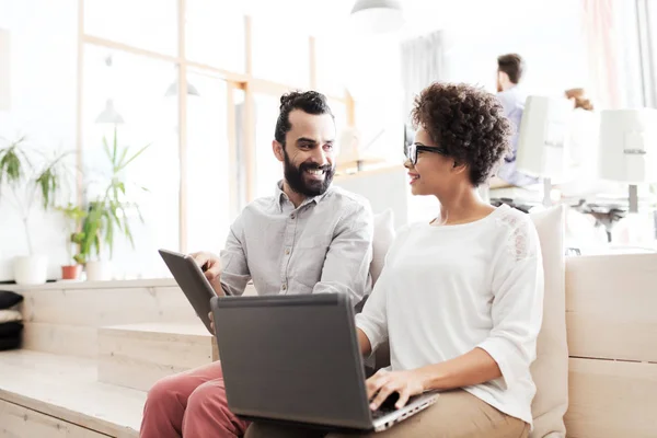 Creative team with laptop and tablet pc at office — Stock Photo, Image