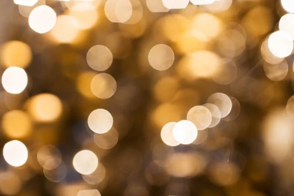 Rozmazané zlaté vánoční světla bokeh — Stock fotografie