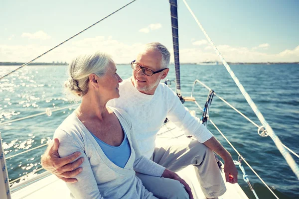 Senior couple hugging on sail boat or yacht in sea — Stock Photo, Image