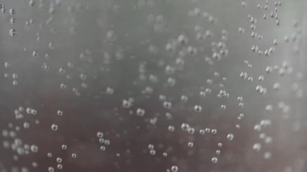 Fizzy drink or bubbles floating up in water — Stock Video