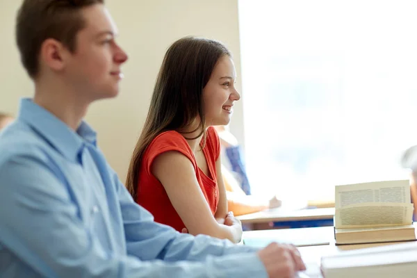 Group of students with notebooks at school lesson — Stock Photo, Image