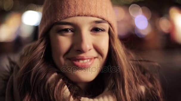 Happy young woman in winter hat at christmas — Stock Video