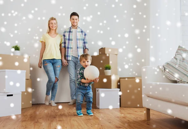 Happy family moving to new home and playing ball — Stock Photo, Image