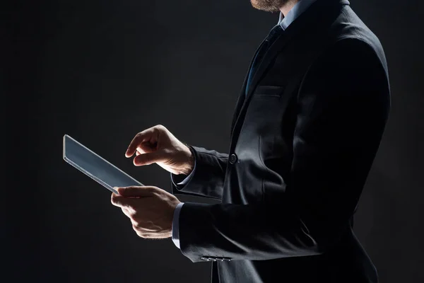 Close up of businessman with transparent tablet pc — Stock Photo, Image