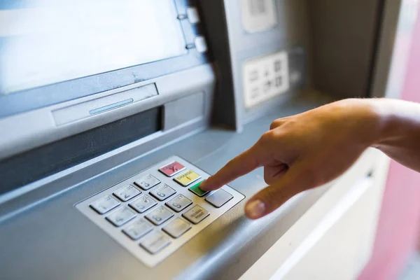 Close up of hand entering pin code at atm machine — Stock Photo, Image