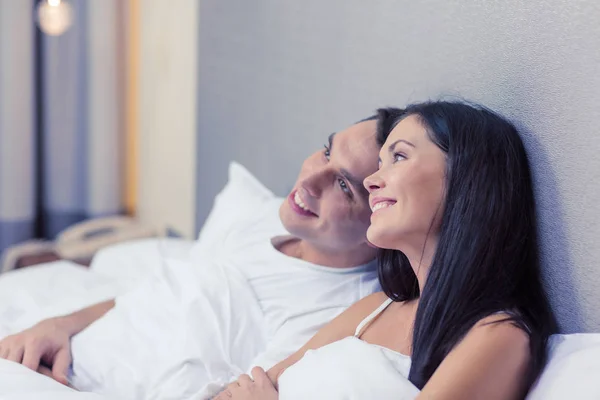 Happy couple dreaming in bed — Stock Photo, Image