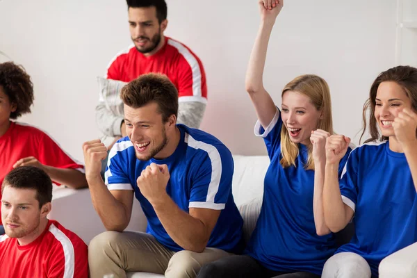 Friends or football fans watching soccer at home — Stock Photo, Image