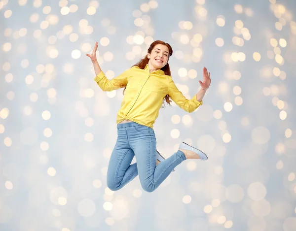 Sorrindo jovem mulher pulando no ar Imagens De Bancos De Imagens Sem Royalties