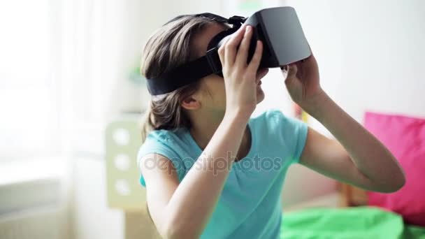 Happy girl in vr headset or 3d glasses at home — Stock Video