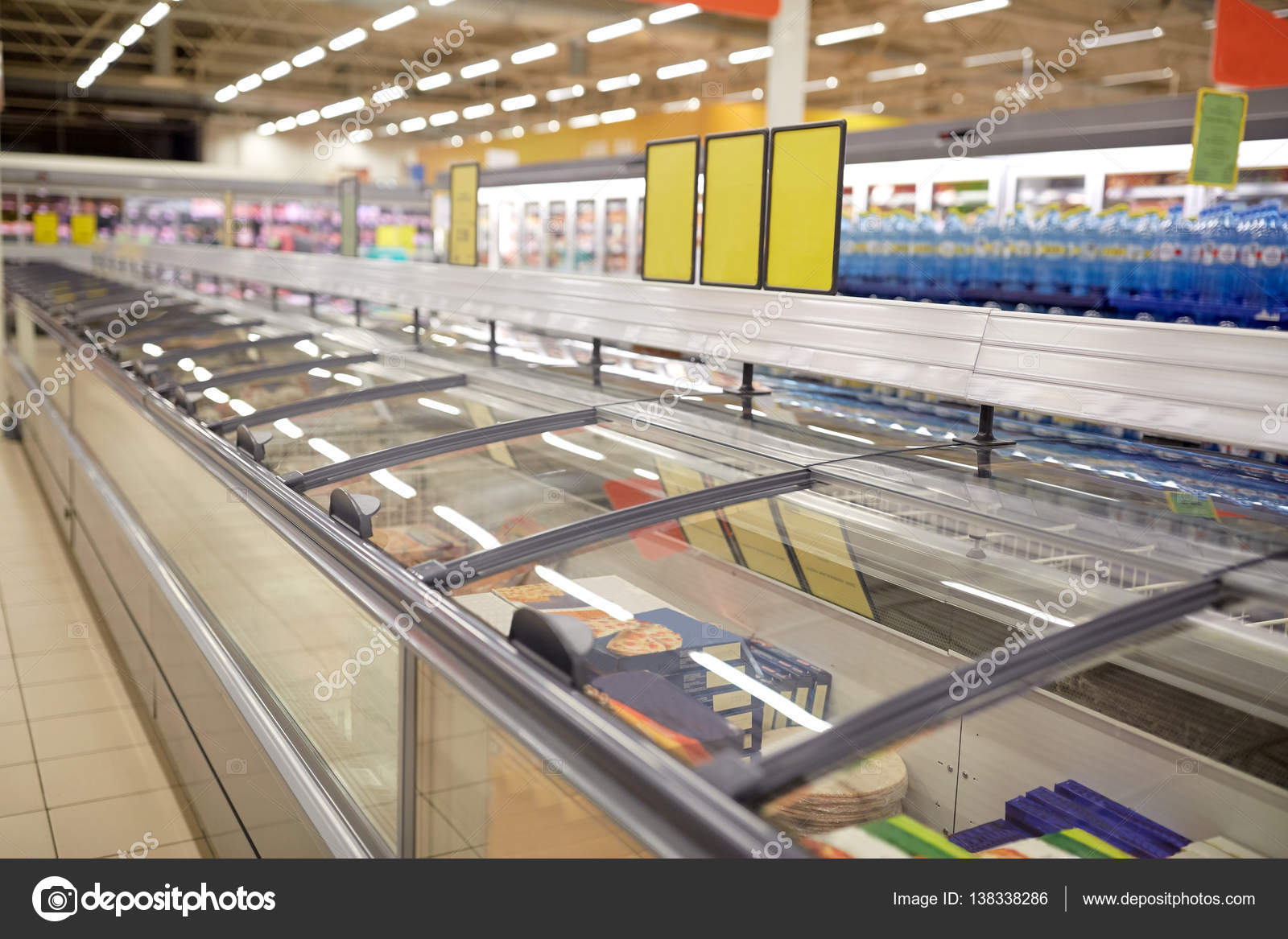 Freezers at grocery store Stock Photo by ©Syda_Productions 138338286