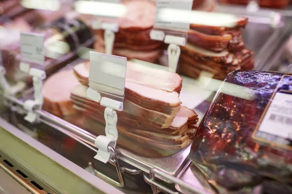 Ham at grocery store stall — Stock Photo, Image