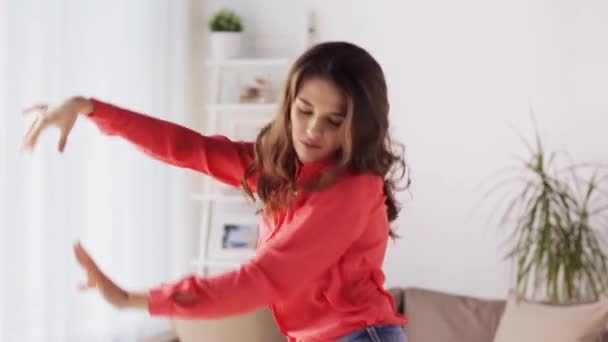 Happy young woman dancing at home — Stock Video