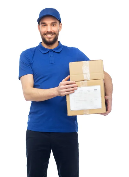 Happy delivery man with parcel boxes — Stock Photo, Image