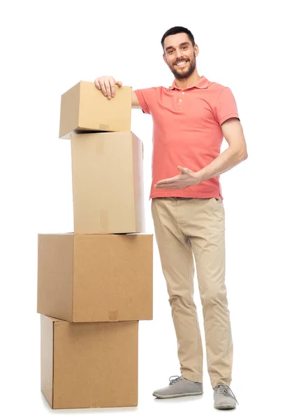 Happy man with cardboard boxes — Stock Photo, Image