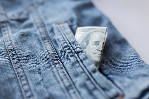 Dollar money in pocket of denim jacket — Stock Photo, Image