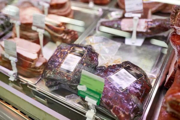 Ham at grocery store stall — Stock Photo, Image