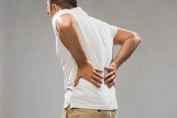 Close up of man suffering from backache — Stock Photo, Image