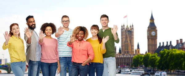 International people waving hand in London Стоковая Картинка
