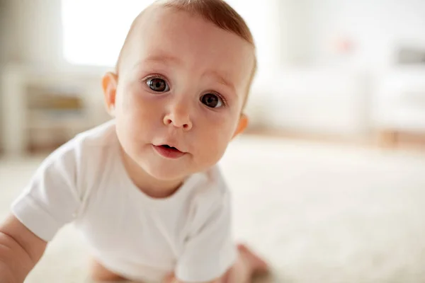 Close up of happy little baby boy or girl at home — Stock Photo, Image