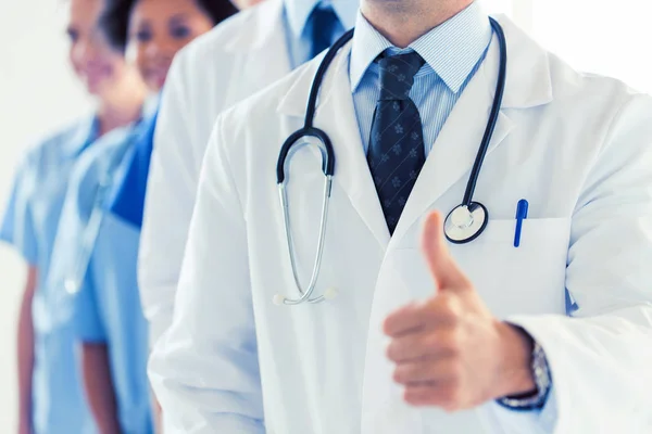 Close up of happy doctor showing thumbs — Stock Photo, Image