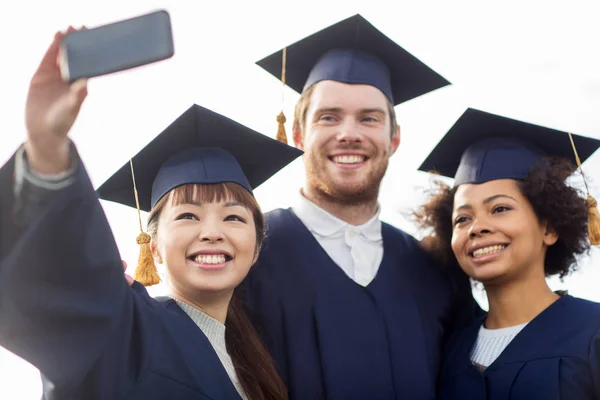 Students or bachelors taking selfie by smartphone — Stock Photo, Image
