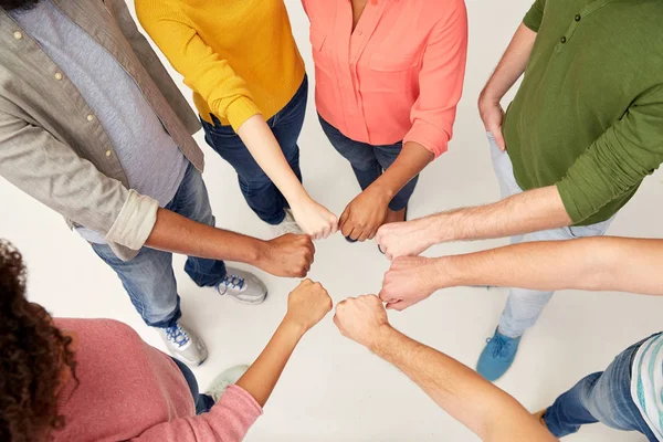 Hands of international people making fist bump — Stock Photo, Image