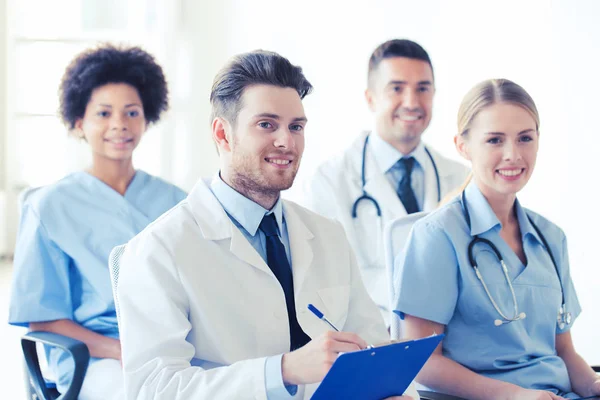 Group of happy doctors on seminar at hospital — Stock Photo, Image