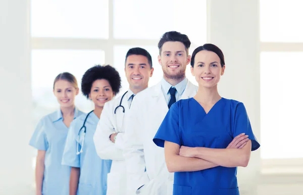 Group of happy doctors at hospital — Stock Photo, Image